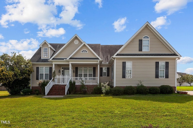 view of front of house with a porch and a front lawn