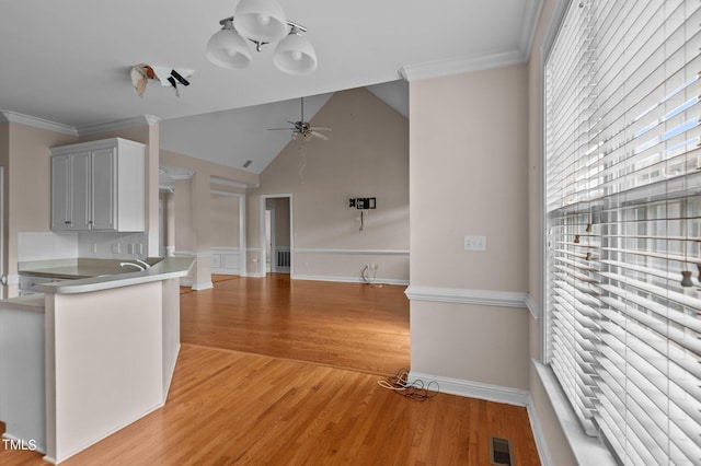 3806 Wyattwood Dr N, Wilson, NC 27896 - kitchen featuring visible vents, light wood-type flooring, crown molding, and ceiling fan