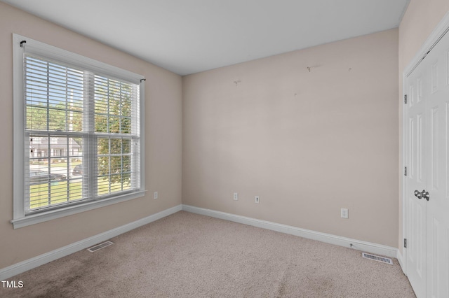 3806 Wyattwood Dr N, Wilson, NC 27896 - spare room with visible vents, baseboards, and carpet flooring
