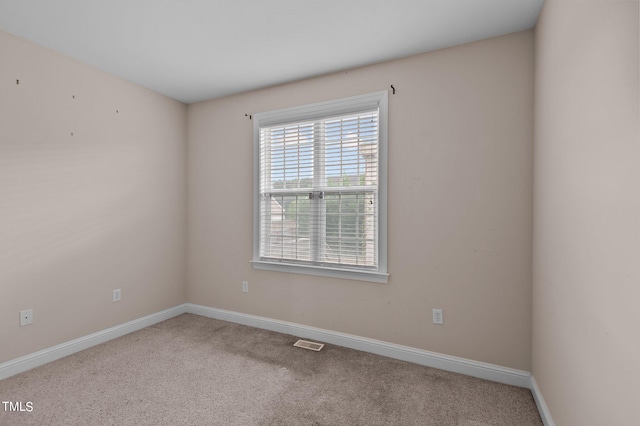 unfurnished room featuring carpet flooring