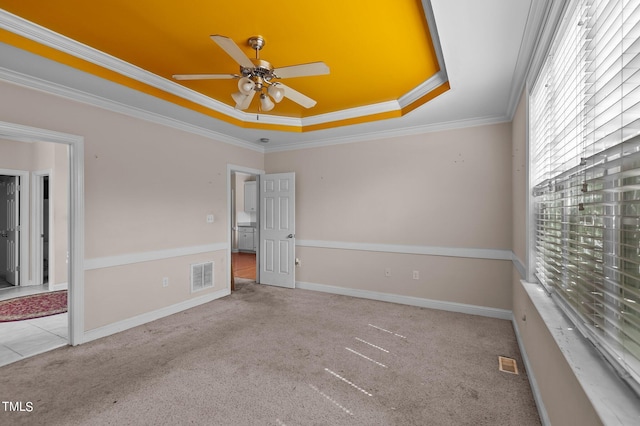 3806 Wyattwood Dr N, Wilson, NC 27896 - carpeted empty room featuring ornamental molding, visible vents, a raised ceiling, and a ceiling fan
