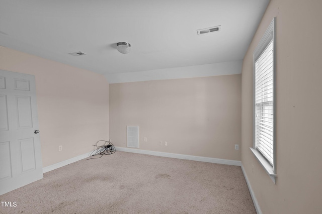 3806 Wyattwood Dr N, Wilson, NC 27896 - spare room featuring visible vents, carpet flooring, and a healthy amount of sunlight