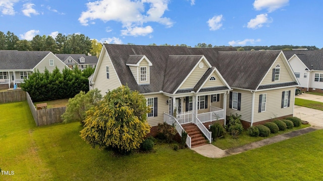 view of front of property featuring a porch and a front lawn