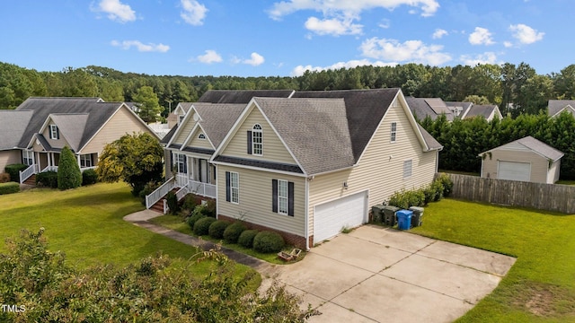 view of front of property with a front yard and a garage