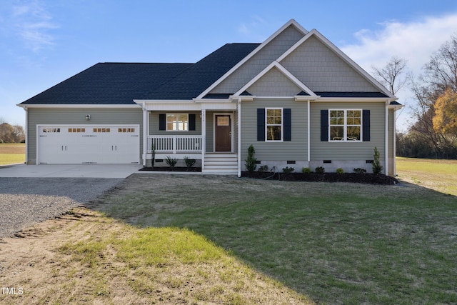 craftsman-style home with a front yard, a porch, and a garage