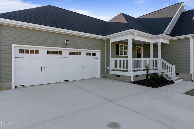 view of front of house featuring covered porch and a garage