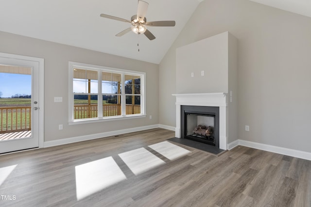 unfurnished living room with ceiling fan, high vaulted ceiling, and light hardwood / wood-style floors