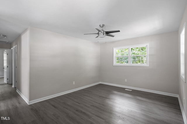 unfurnished room featuring ceiling fan and dark hardwood / wood-style flooring