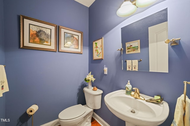 bathroom featuring toilet and sink