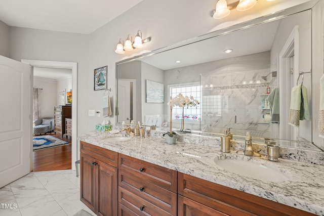 bathroom with vanity, wood-type flooring, and walk in shower