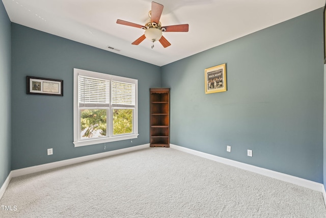 unfurnished room featuring carpet floors and ceiling fan