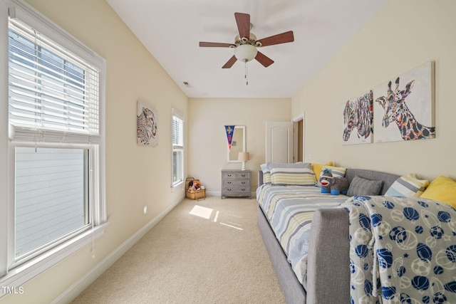 bedroom with multiple windows, carpet flooring, and ceiling fan