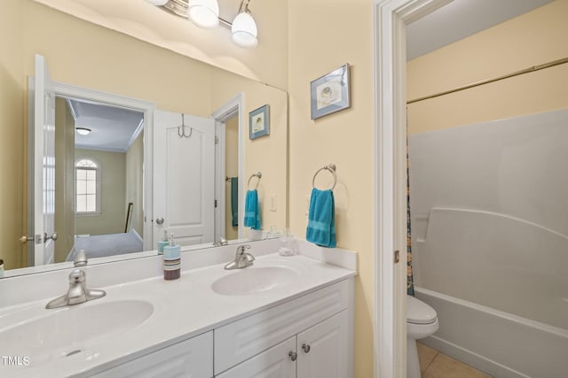 full bathroom featuring toilet, shower / bath combo with shower curtain, vanity, and tile patterned floors