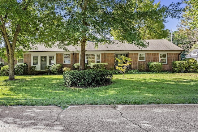 ranch-style house with a front lawn