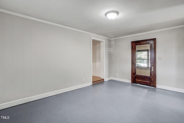 empty room featuring crown molding