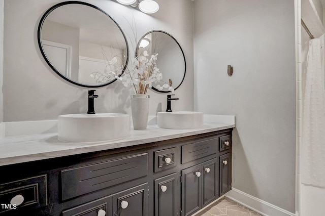 bathroom featuring walk in shower and vanity