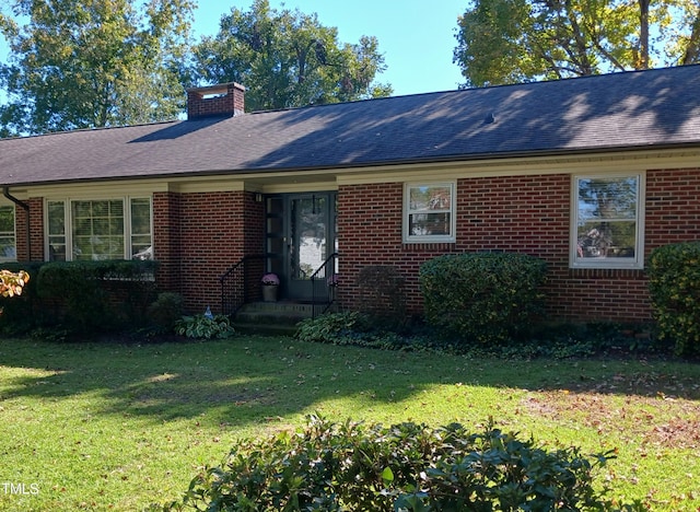 single story home featuring a front yard