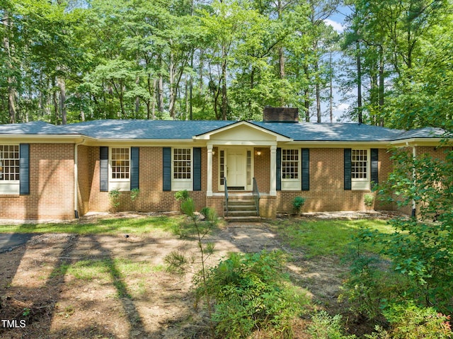 3006 Pump Station Ln, Durham, NC 27712 - single story home featuring brick siding, a chimney, and a shingled roof