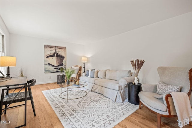 3006 Pump Station Ln, Durham, NC 27712 - living room featuring light wood-type flooring and baseboards