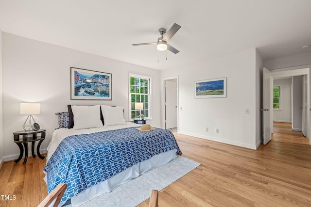 3006 Pump Station Ln, Durham, NC 27712 - bedroom with light wood finished floors and ceiling fan