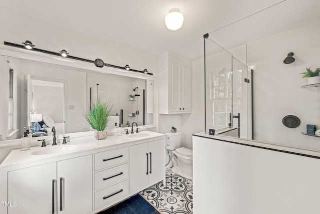 3006 Pump Station Ln, Durham, NC 27712 - full bath featuring a stall shower, double vanity, ensuite bathroom, and tile patterned flooring