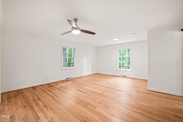 3006 Pump Station Ln, Durham, NC 27712 - spare room featuring plenty of natural light, light wood-style floors, ornamental molding, and ceiling fan