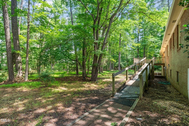 3006 Pump Station Ln, Durham, NC 27712 - view of yard with a wooden deck