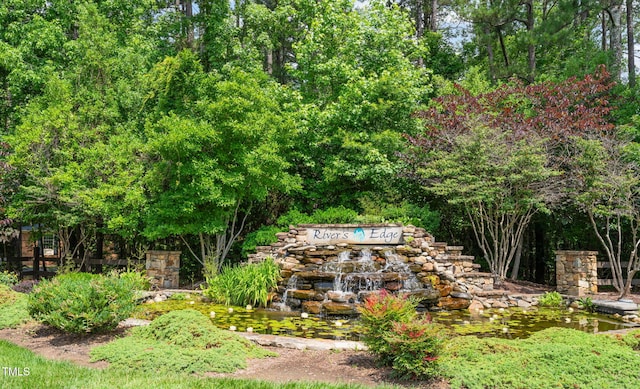 3006 Pump Station Ln, Durham, NC 27712 - view of yard featuring a garden pond