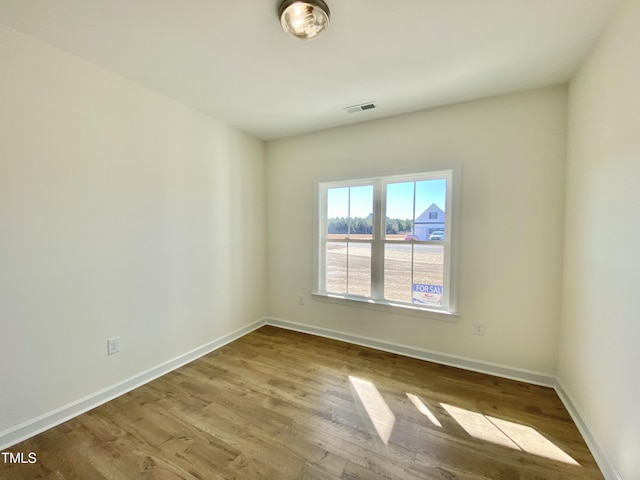 spare room with light wood-type flooring