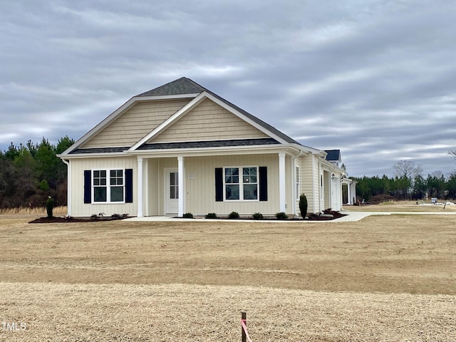 view of front of property featuring a garage and a front lawn