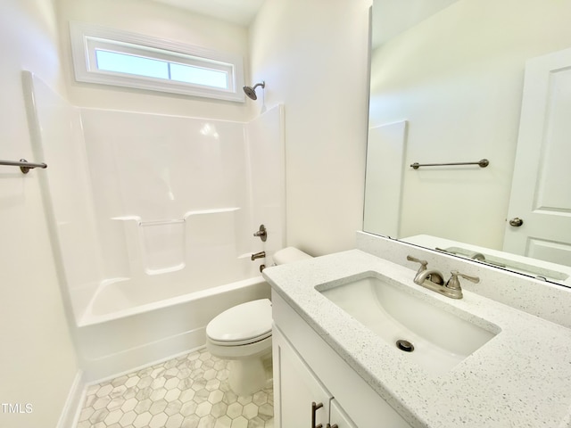 bathroom with washtub / shower combination, toilet, and vanity