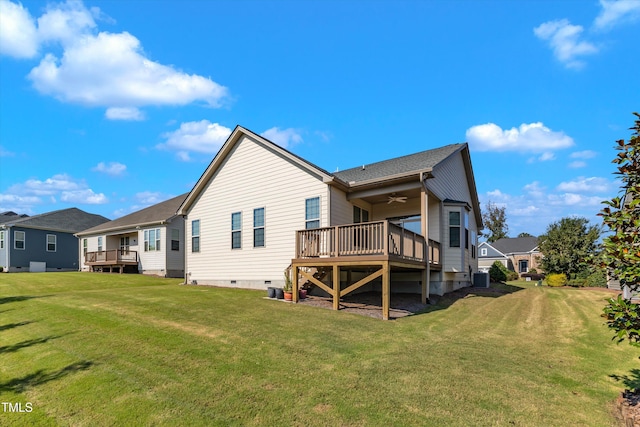 back of property with a lawn, central AC, ceiling fan, and a deck