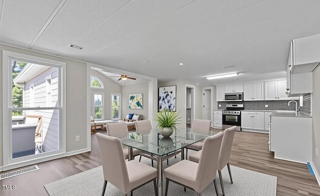 4193 Ji Oakes Rd, Bullock, NC 27507 - dining space with dark wood-style flooring, baseboards, and ceiling fan