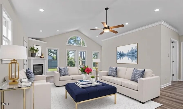 4193 Ji Oakes Rd, Bullock, NC 27507 - living room with a ceiling fan, wood finished floors, lofted ceiling, recessed lighting, and a glass covered fireplace