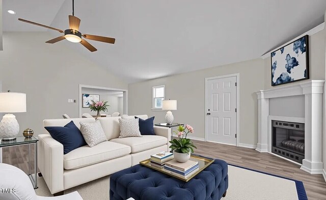 4193 Ji Oakes Rd, Bullock, NC 27507 - living area with a ceiling fan, wood finished floors, a glass covered fireplace, lofted ceiling, and recessed lighting
