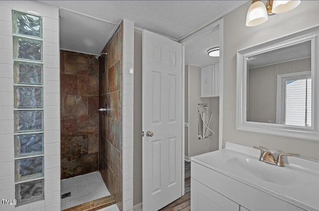 4193 Ji Oakes Rd, Bullock, NC 27507 - full bath with a tile shower, vanity, and wood finished floors