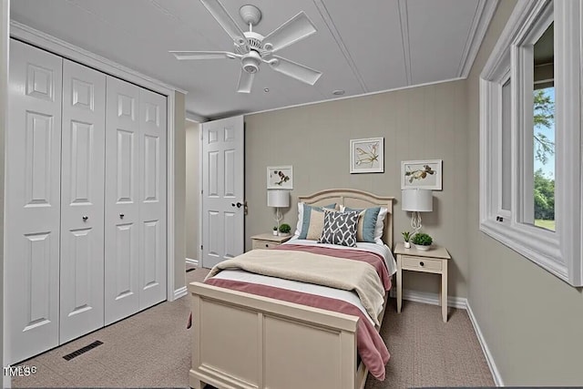 4193 Ji Oakes Rd, Bullock, NC 27507 - bedroom with carpet floors, baseboards, ceiling fan, a closet, and crown molding
