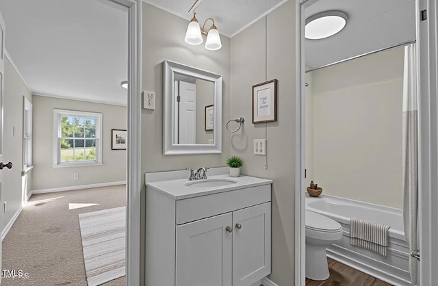 4193 Ji Oakes Rd, Bullock, NC 27507 - full bath with toilet, vanity, shower / bath combo, crown molding, and baseboards