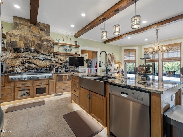 kitchen featuring sink, a large island, stainless steel appliances, pendant lighting, and beam ceiling