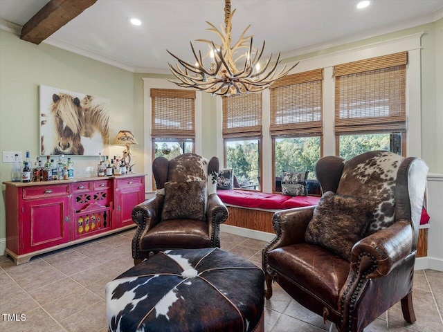 sitting room with beam ceiling, crown molding, light tile patterned floors, and a chandelier