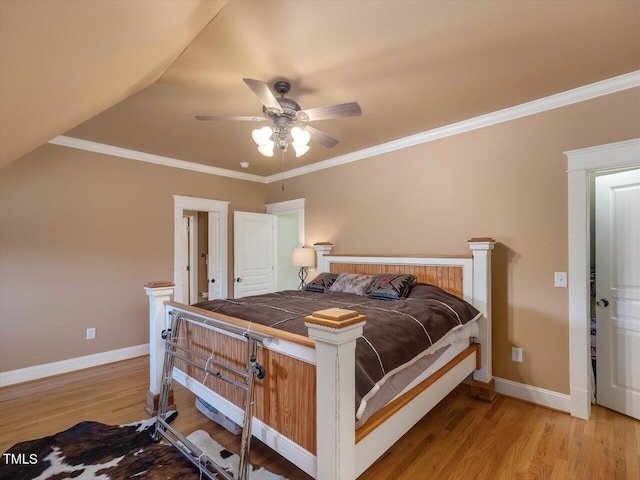 bedroom with ceiling fan, ornamental molding, and light wood-type flooring