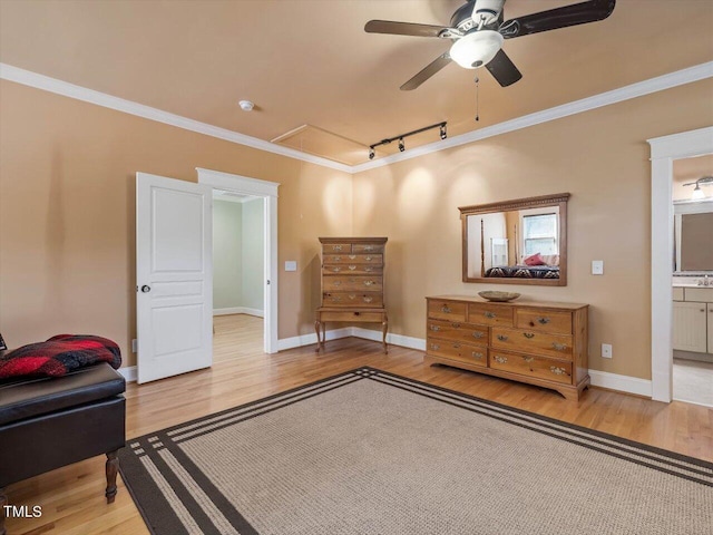 bedroom with track lighting, ensuite bath, hardwood / wood-style floors, crown molding, and ceiling fan