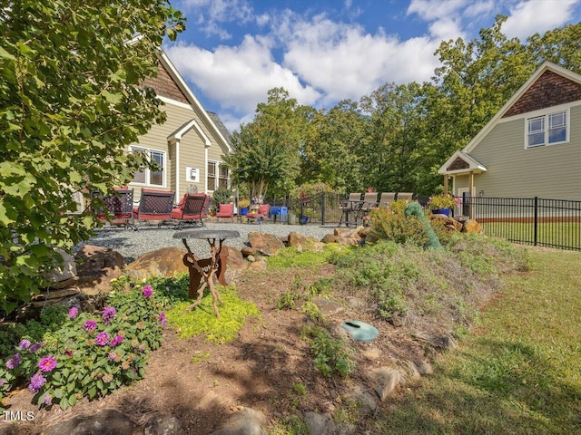 view of yard featuring a wooden deck and a patio area