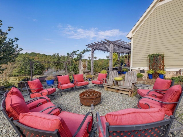 view of patio featuring an outdoor fire pit and a pergola