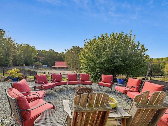 view of patio / terrace featuring an outdoor fire pit