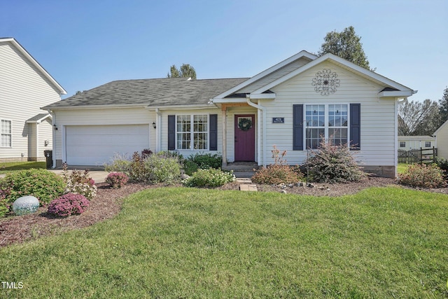 view of front facade with a garage and a front yard