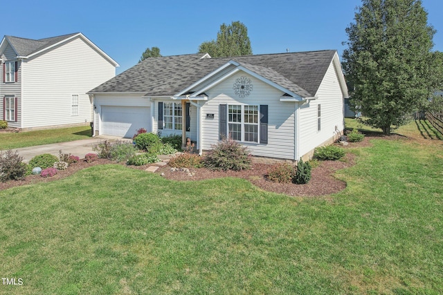 view of front facade with a front yard and a garage