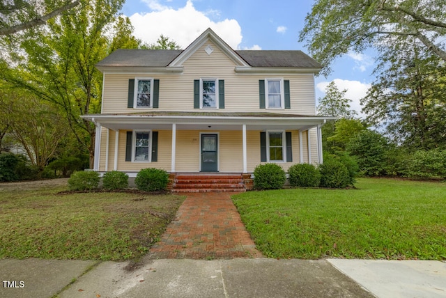 view of front of property featuring a porch and a front yard