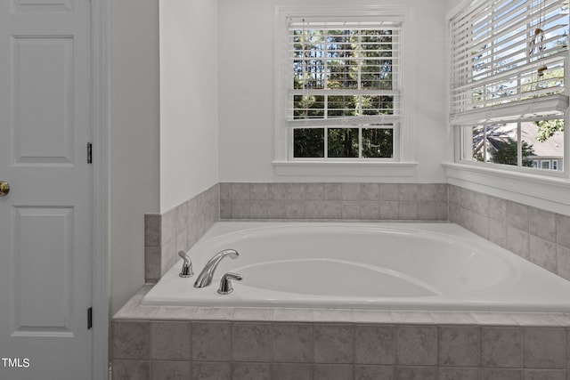 bathroom featuring tiled bath