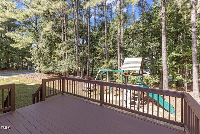 wooden deck featuring a playground